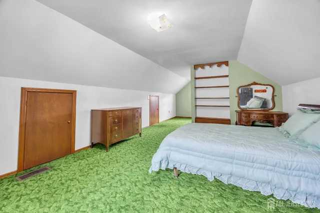 a bed room with a bed and a window