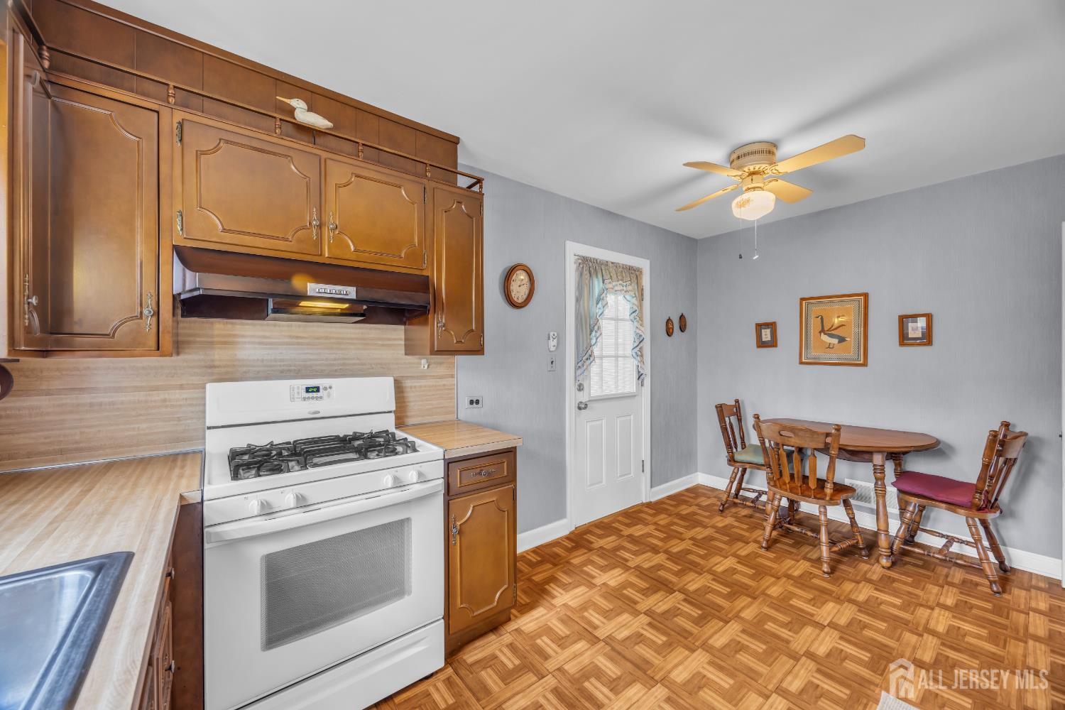 143 Safran Avenue Edison, NJ 08837 - Photo 15 of 35 a kitchen with stainless steel appliances granite countertop a stove a sink dishwasher and a refrigerator with wooden cabinets