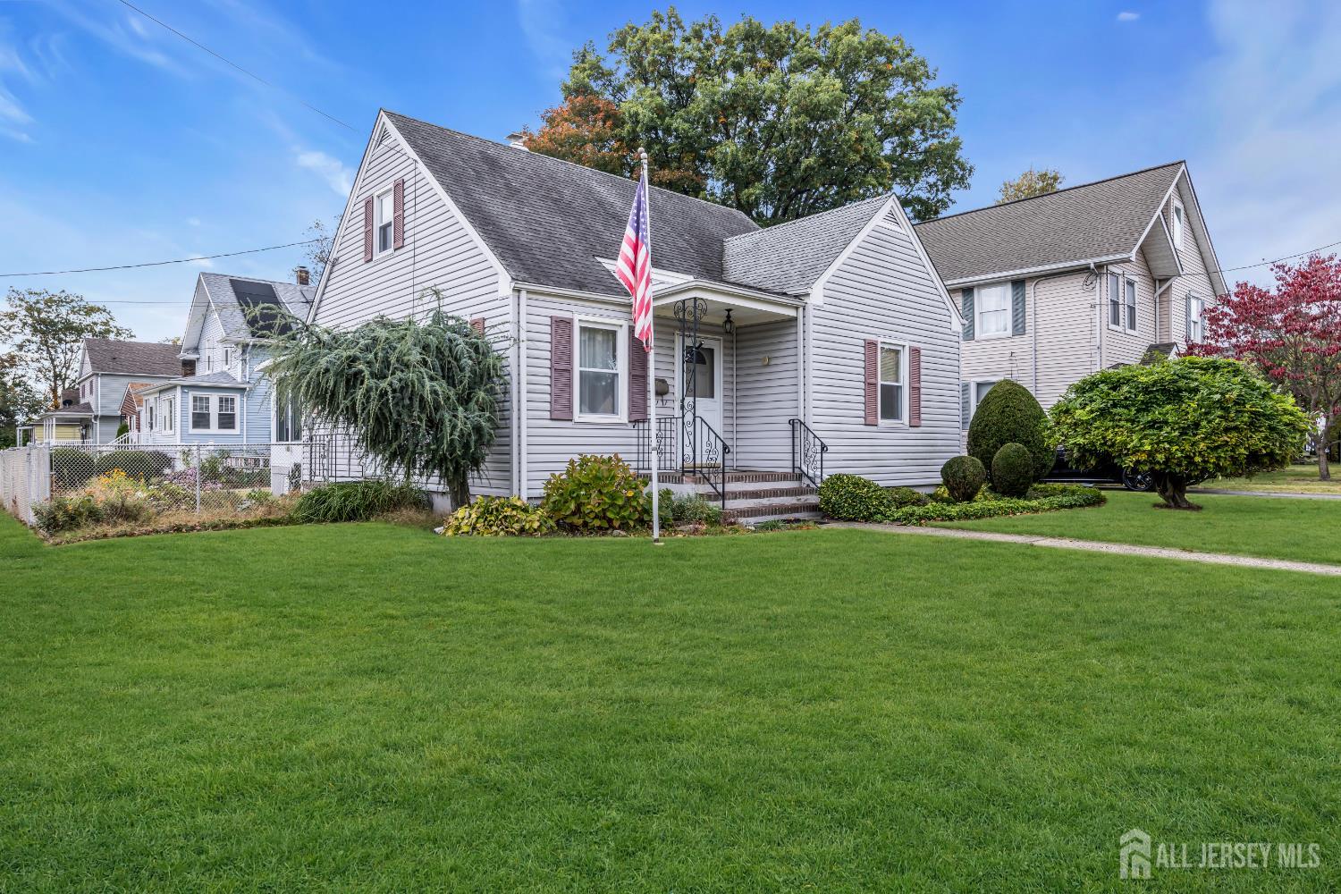 143 Safran Avenue Edison, NJ 08837 - Photo 2 of 35 a front view of a house with a garden