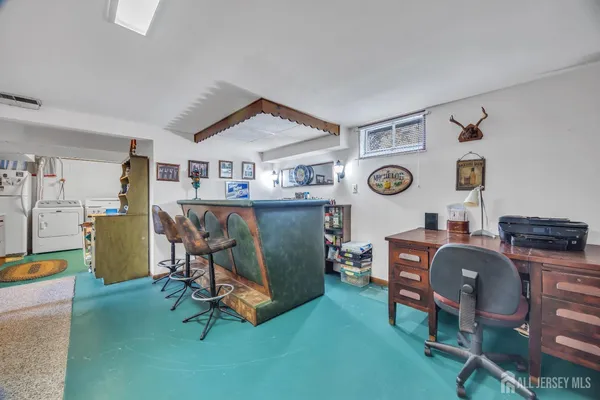 a living room with furniture and a clock