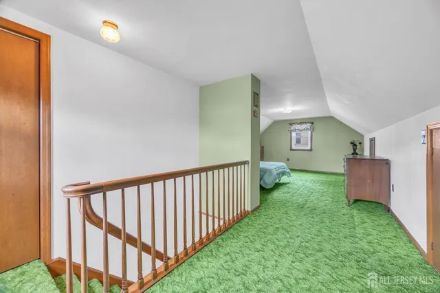 a bathroom with a granite countertop toilet and a sink