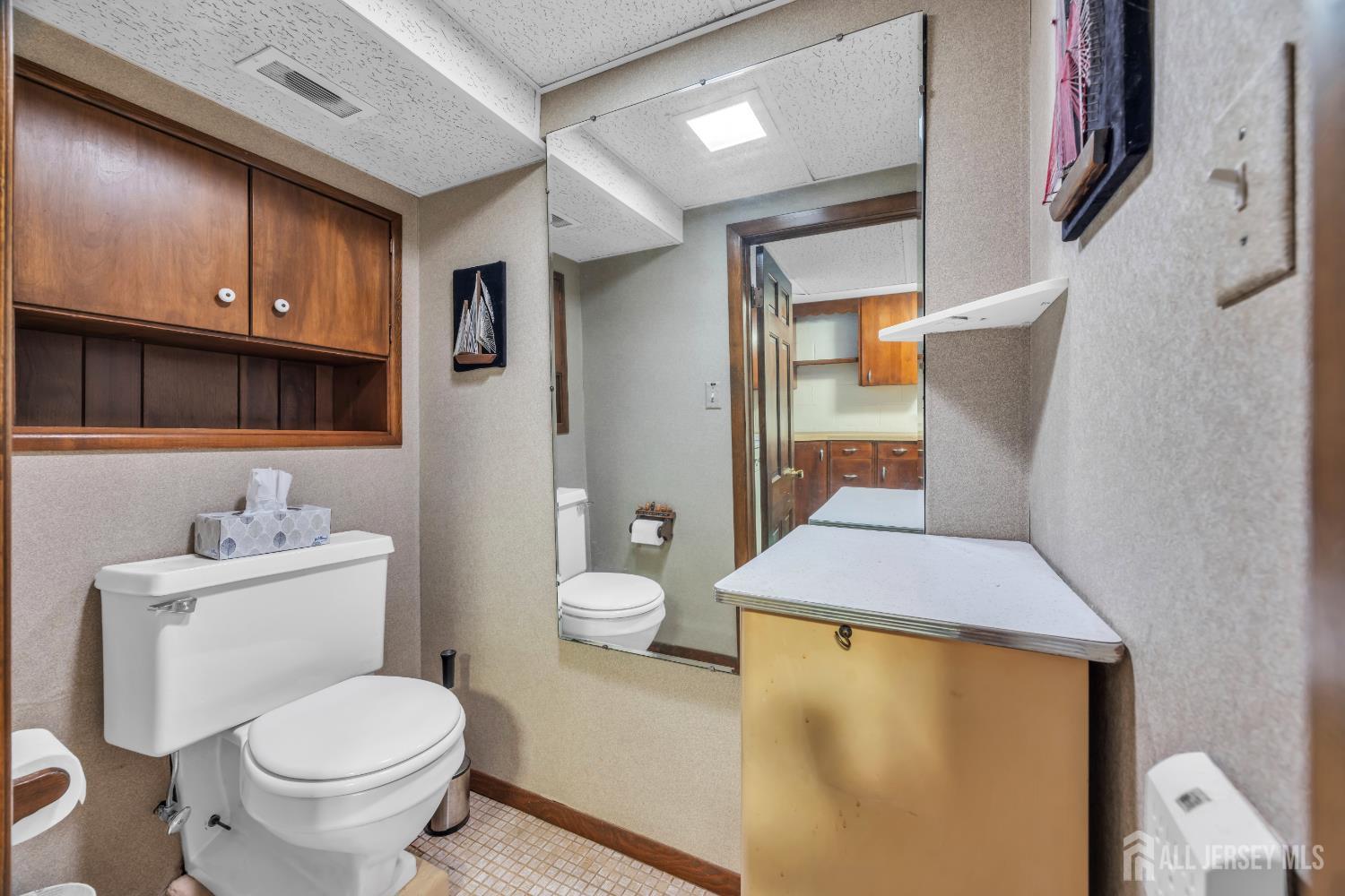 143 Safran Avenue Edison, NJ 08837 - Photo 31 of 35 a bathroom with a granite countertop toilet and a sink