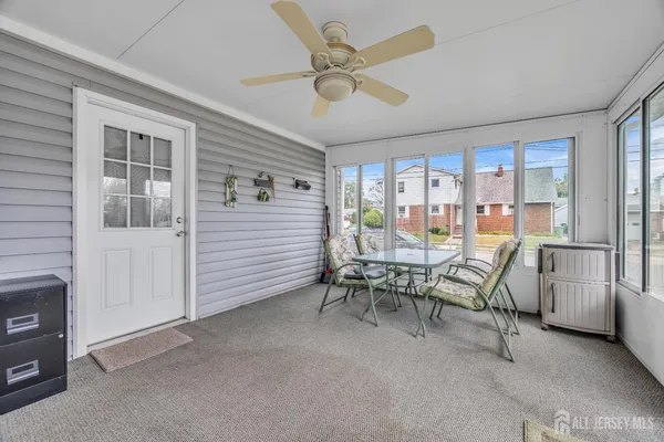 a front view of house with a garden and patio