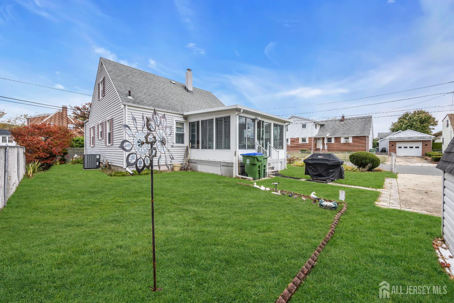 143 Safran Avenue Edison, NJ 08837 - Photo 34 of 35 a front view of house with a garden and patio