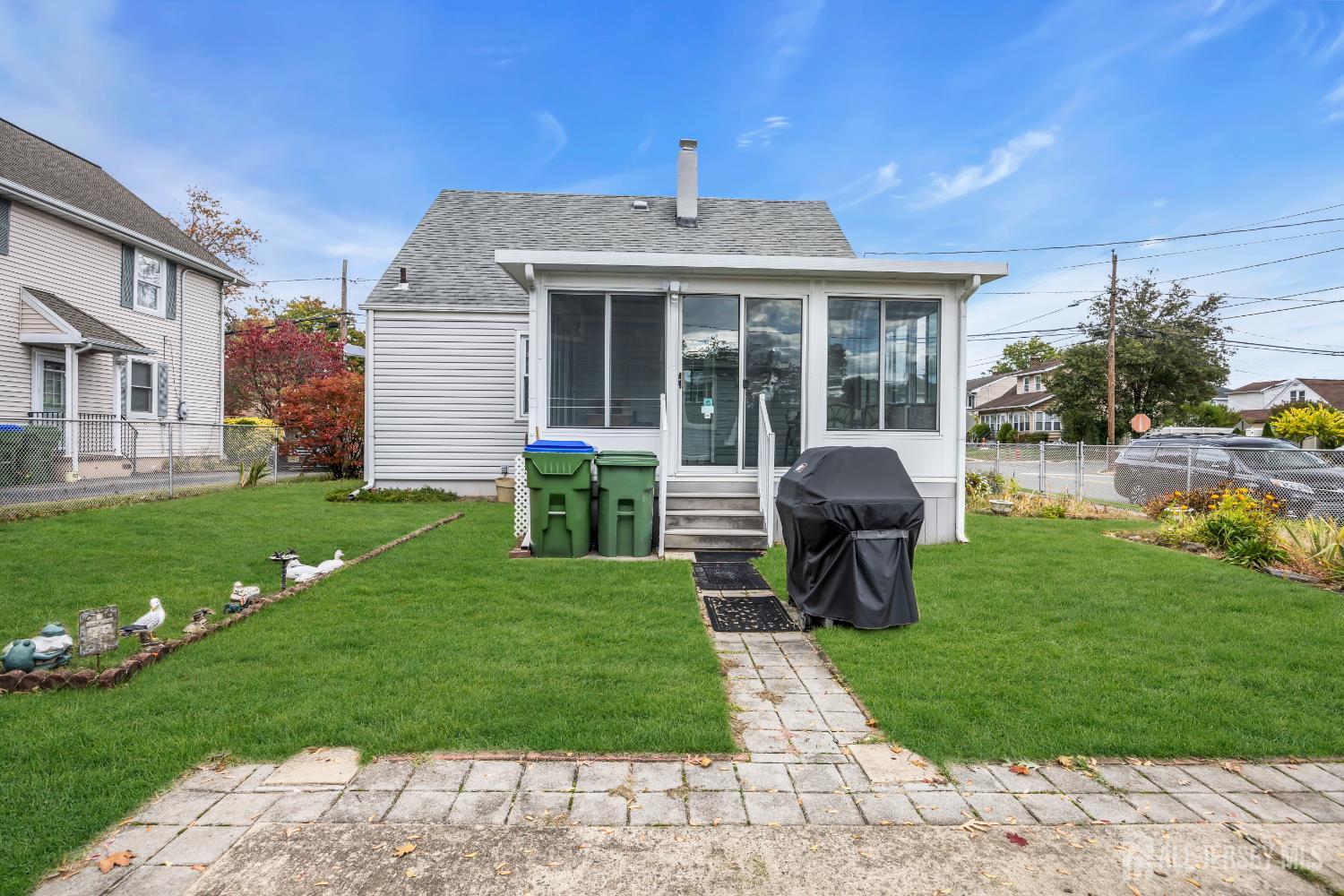 143 Safran Avenue Edison, NJ 08837 - Photo 35 of 35 a front view of a house with a yard