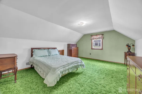 a bedroom with a bed and a table