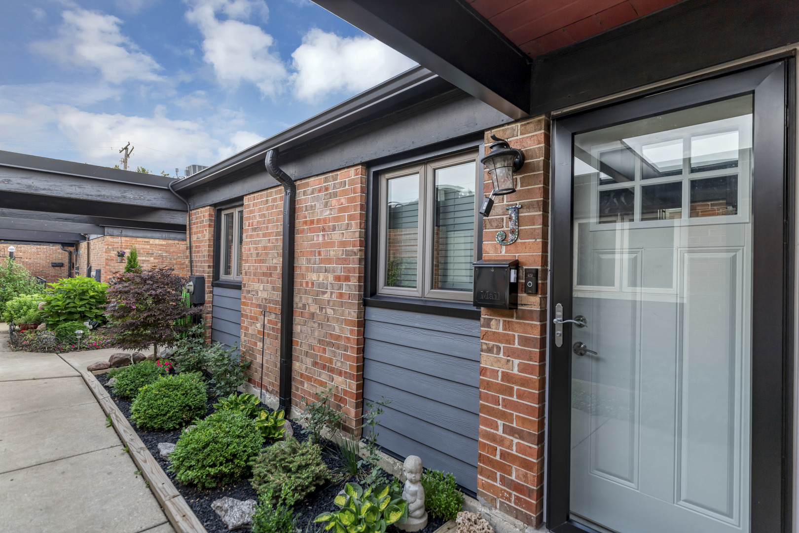 7754 West Higgins Road, Unit J Chicago, IL 60631 - Photo 2 of 23 a porch with seating space