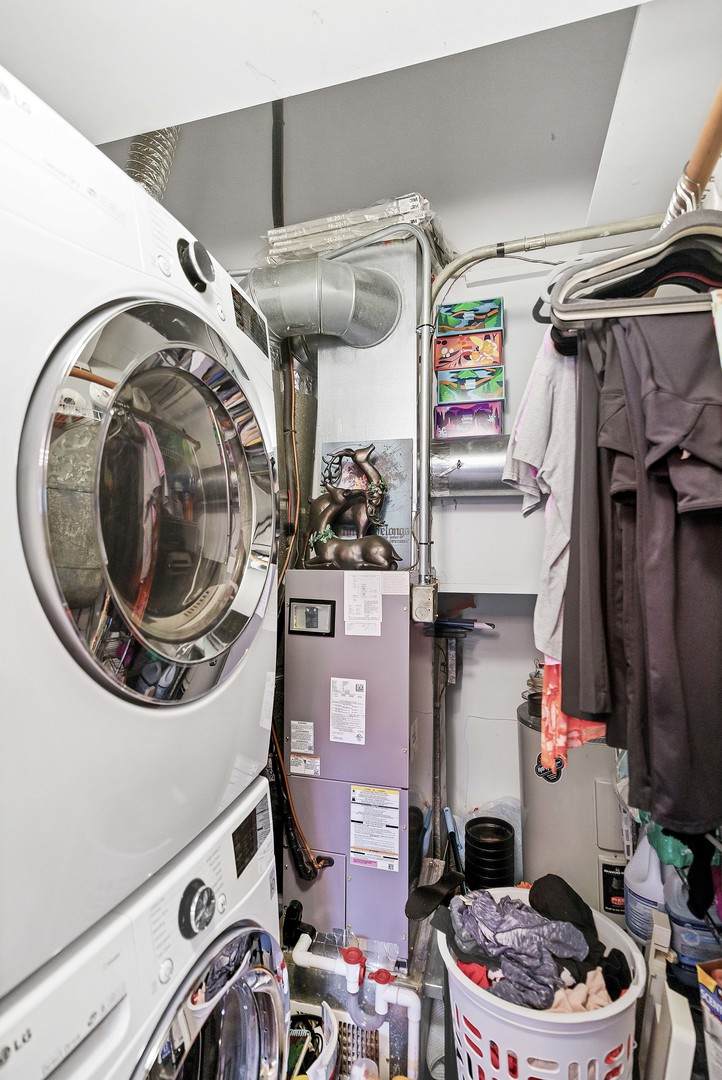 7754 West Higgins Road, Unit J Chicago, IL 60631 - Photo 22 of 23 a utility room with dryer and washer