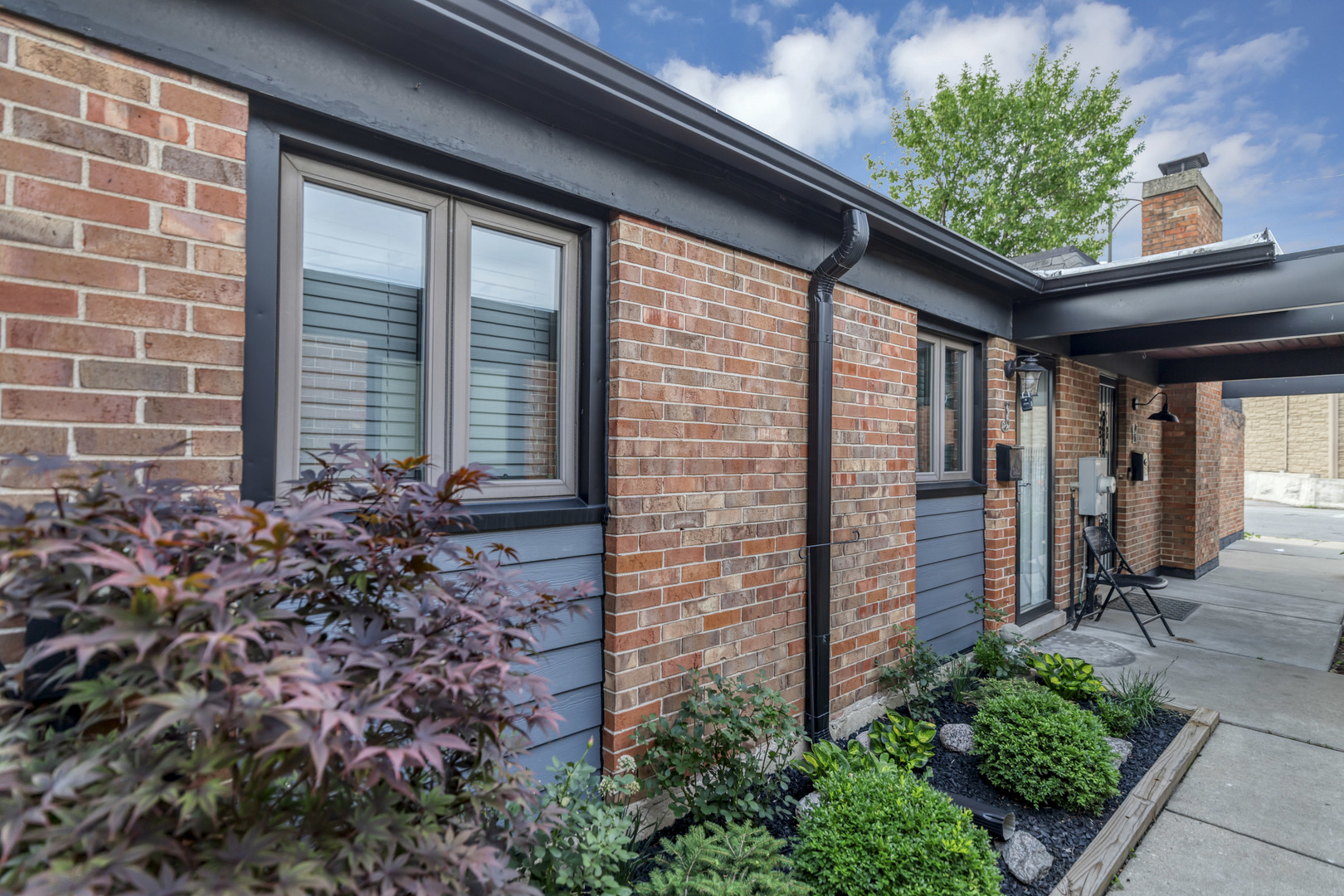 7754 West Higgins Road, Unit J Chicago, IL 60631 - Photo 3 of 23 a front view of a house with a large window