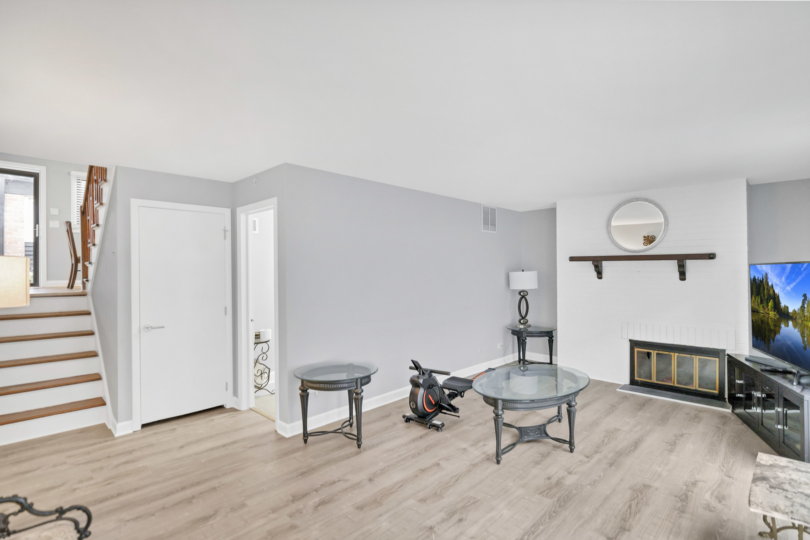 7754 West Higgins Road, Unit J Chicago, IL 60631 - Photo 4 of 23 a living room with furniture and a wooden floor