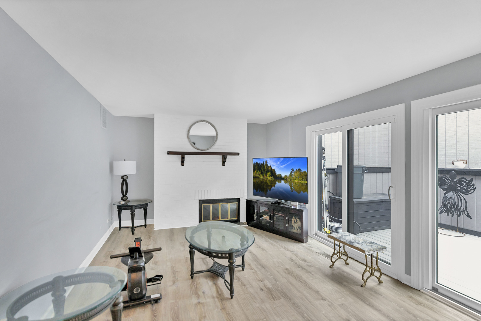 7754 West Higgins Road, Unit J Chicago, IL 60631 - Photo 6 of 23 a living room with furniture a rug and a painting on the wall