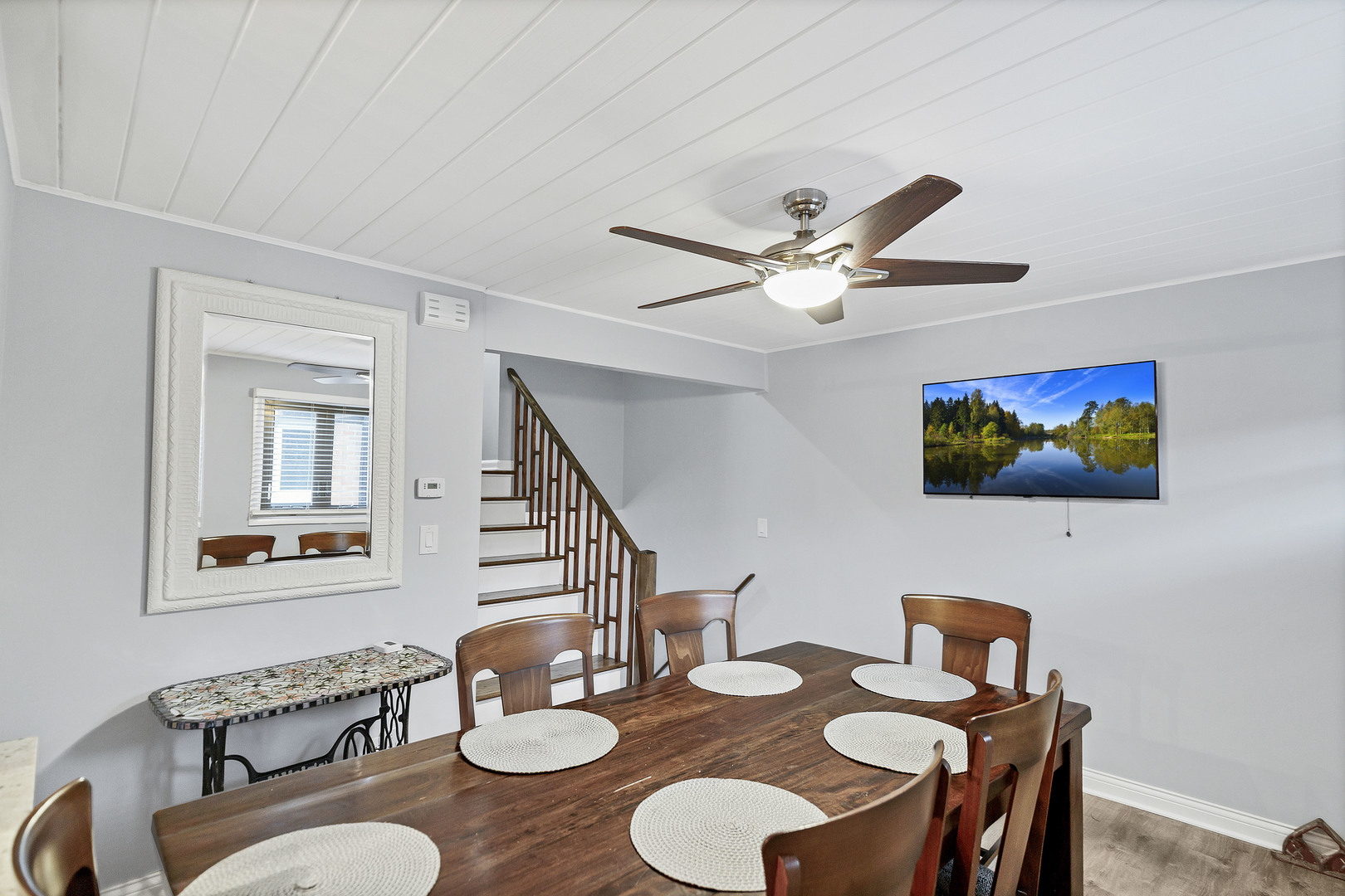 7754 West Higgins Road, Unit J Chicago, IL 60631 - Photo 9 of 23 a dining room with furniture and a wooden floor