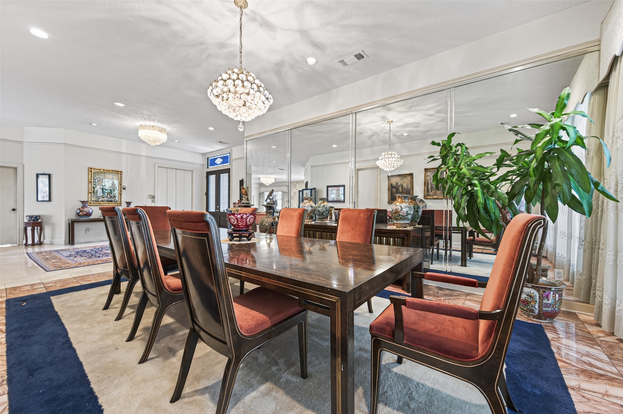8103 Lake Edge Court Houston, TX 77071 - Photo 7 of 48 Formal dining with mirrored wall enhancing space and natural light