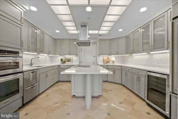 a kitchen with a sink cabinets and window