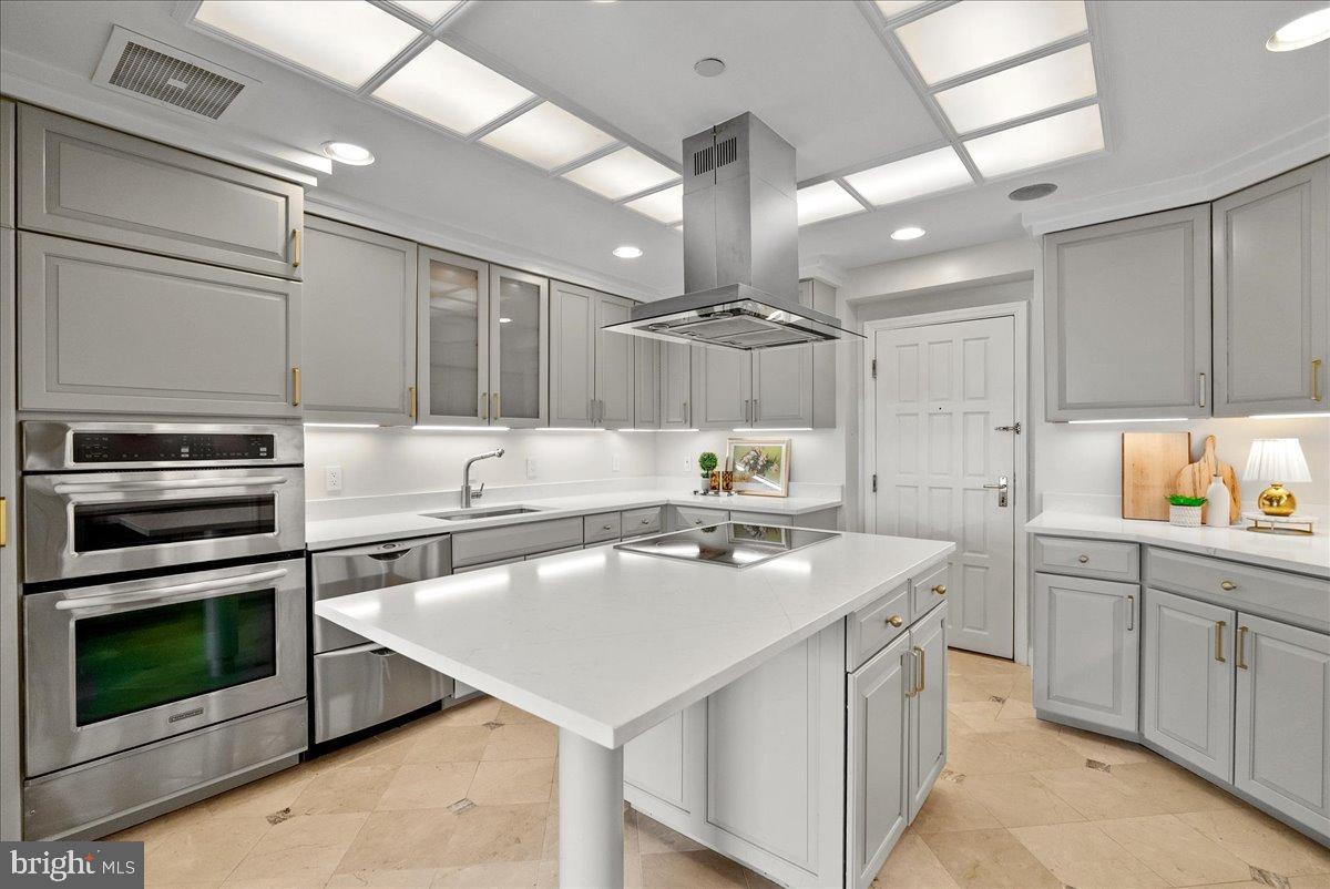 1530 Key Boulevard, Unit 1310 Arlington, VA 22209 - Photo 14 of 37 Sleek modern kitchen with elegant finishes.