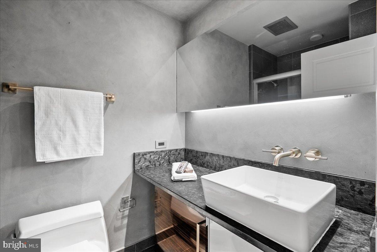 1530 Key Boulevard, Unit 1310 Arlington, VA 22209 - Photo 19 of 37 Sleek modern bathroom with elegant finishes.