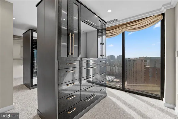 a bathroom with a glass door shower and sink