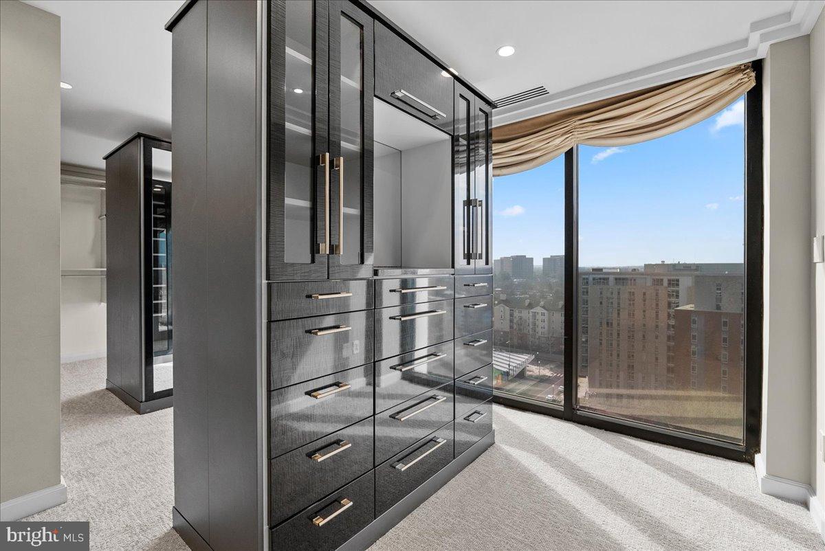 1530 Key Boulevard, Unit 1310 Arlington, VA 22209 - Photo 21 of 37 Sleek modern closet with city views.