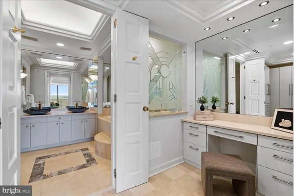 a large bathroom with a sink mirror and a shower