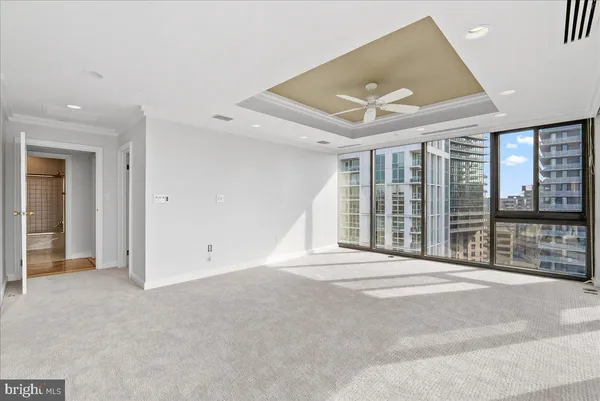 a view of an empty room with a balcony