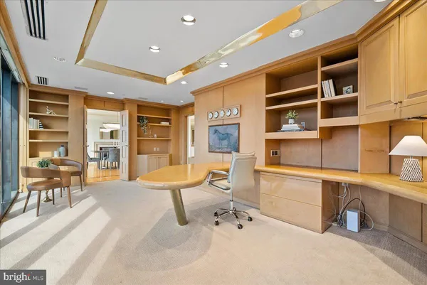 a very nice looking room with a large window and furniture