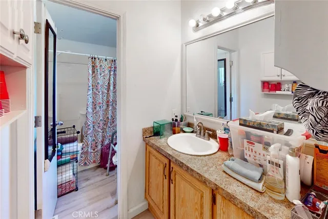 a bathroom with a sink double vanity and a mirror