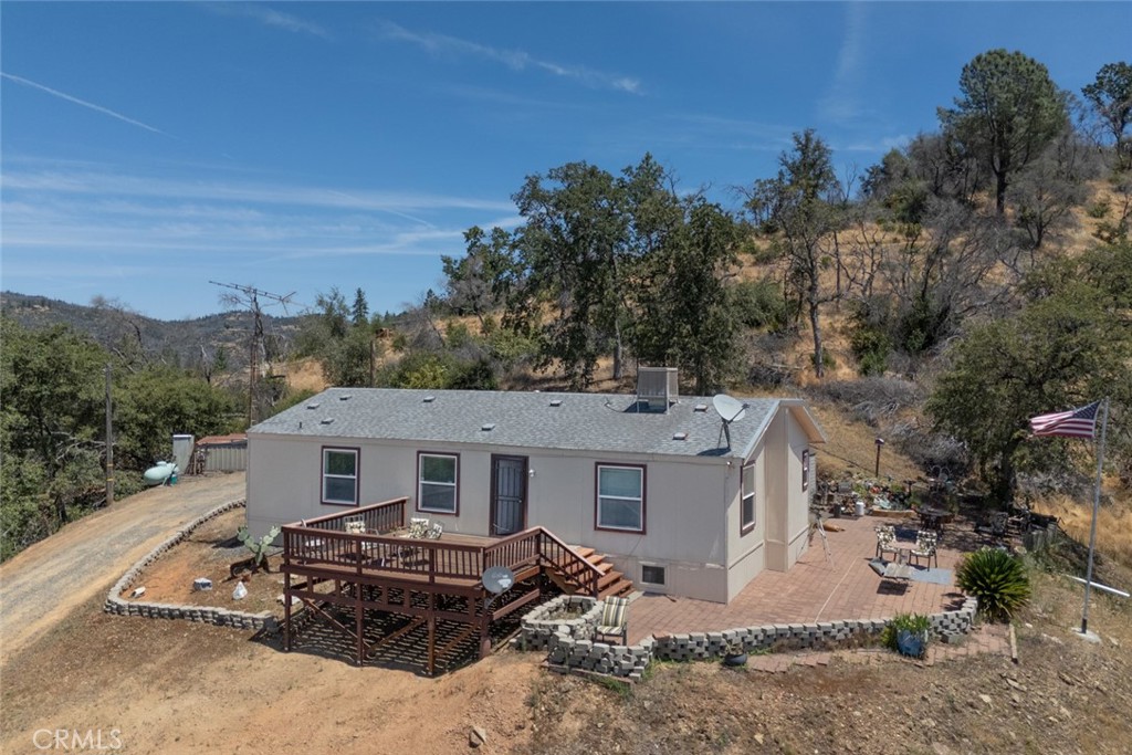 280 Canyon Creek Road Berry Creek, CA 95916 - Photo 2 of 36 an aerial view of a house with a garden