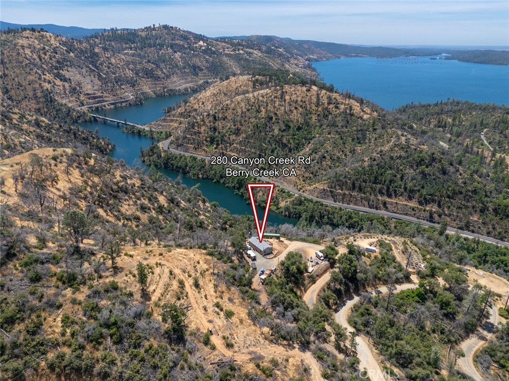 280 Canyon Creek Road Berry Creek, CA 95916 - Photo 24 of 36 a aerial view of a house with a yard and mountain view in back