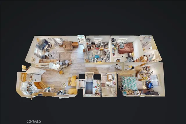 a bed sitting in a bedroom next to a lamp