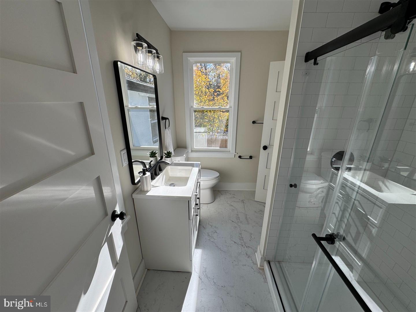 66 East 3rd Street Moorestown, NJ 08057 - Photo 25 of 33 a bathroom with a sink a toilet and shower