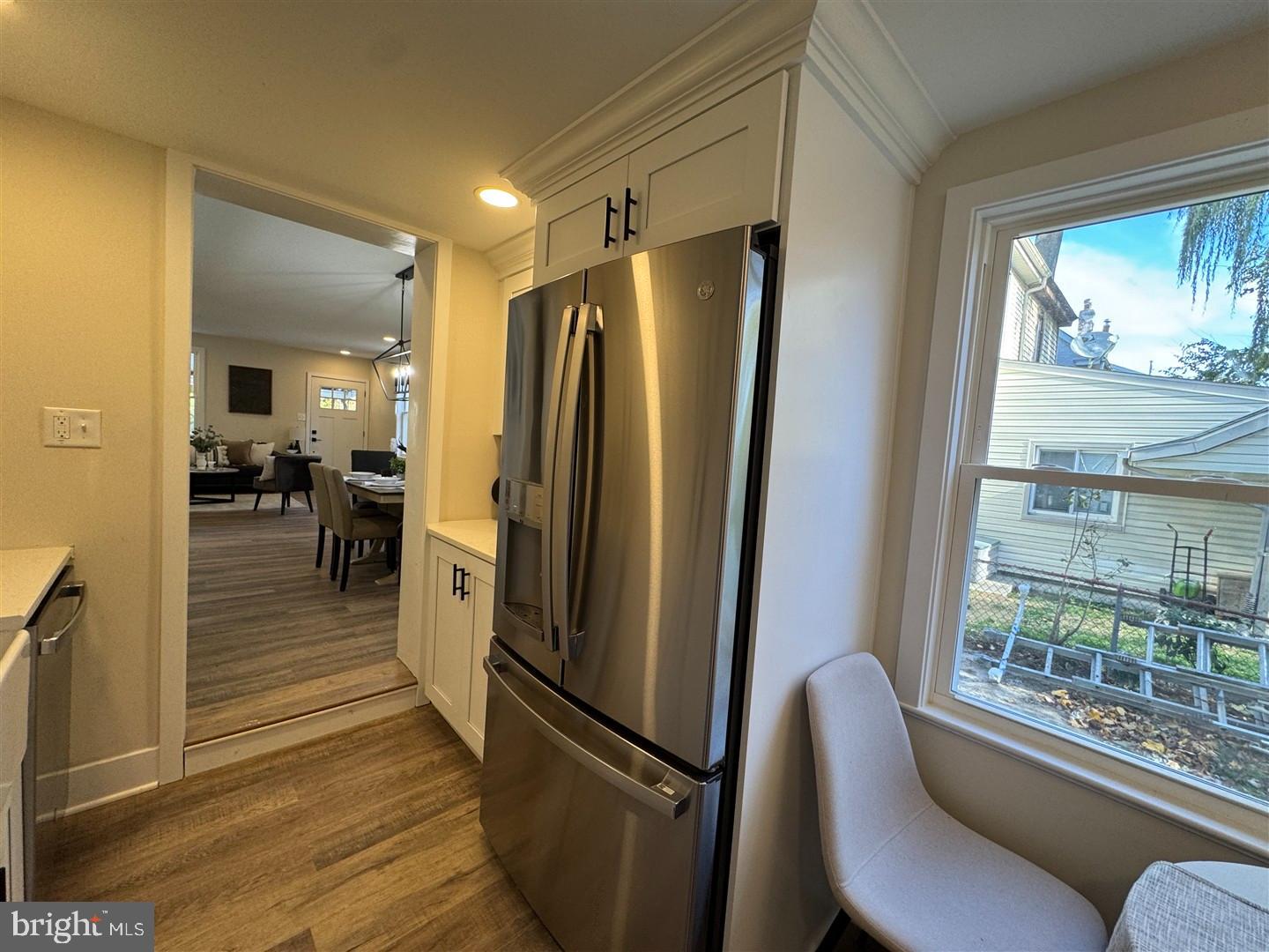 66 East 3rd Street Moorestown, NJ 08057 - Photo 10 of 33 a kitchen with stainless steel appliances granite countertop a refrigerator and a view of living room