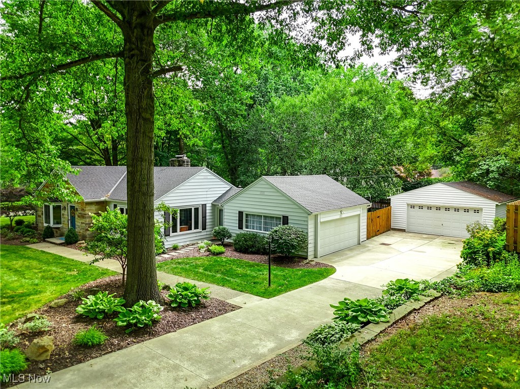 2488 Holgate Road Akron, OH 44313 - Photo 2 of 50 Well maintained ranch home including a beautifully landscaped yard. A portion of the yard behind the home is fully fenced. Easy access to both garages. New roof (2018) - completed tear off with new gutters and gutter guards. New concrete in 2018.