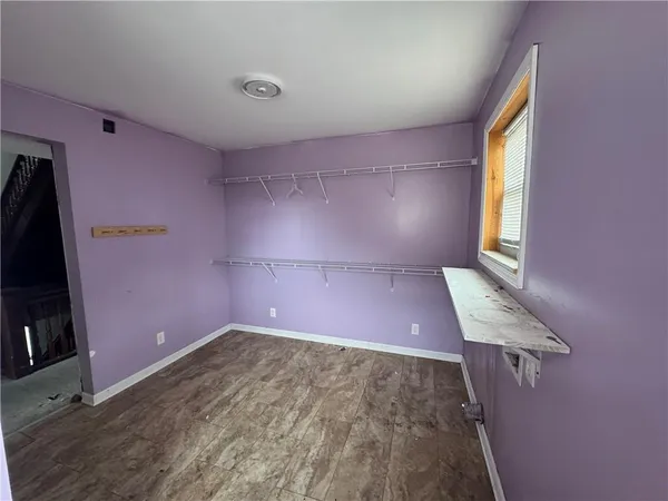 a bathroom with a tub sink toilet and a mirror