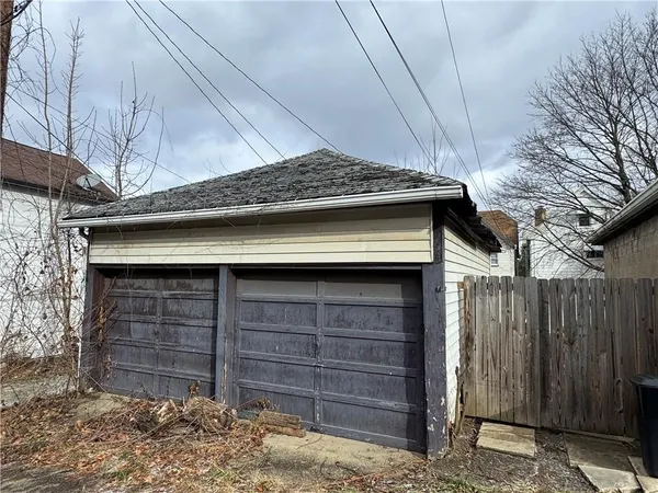 a view of house with a tree