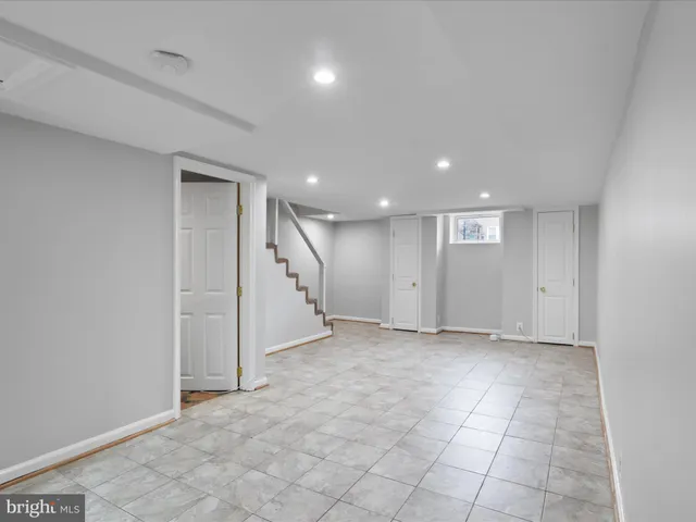 a bathroom with a sink toilet and a mirror