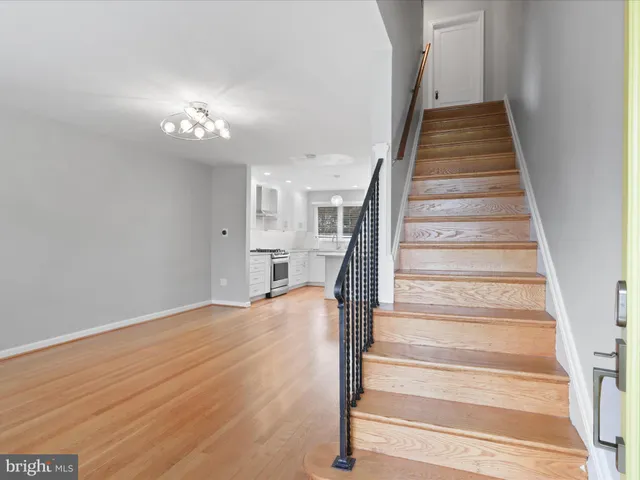 a view of staircase with white walls and windows