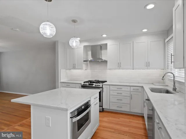 a kitchen with a stove and a sink