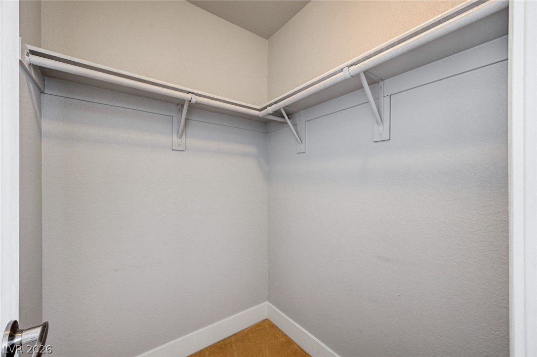 7259 Cestrum Road Las Vegas, NV 89113 - Photo 24 of 35 Functional closet space offers integrated shelving and hanging rods, maximizing storage possibilities.