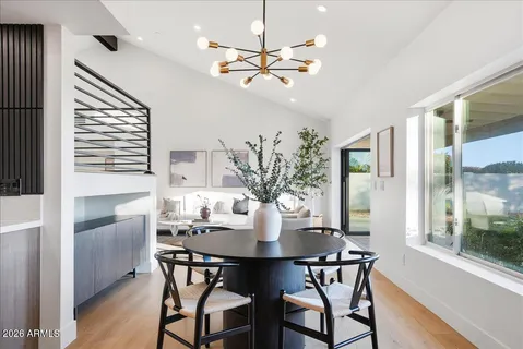 a view of a dining room with furniture window and wooden floor