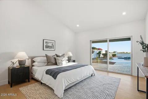 a bedroom with a large bed and a view of bedroom