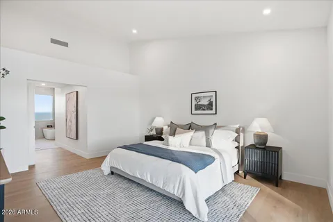 a bedroom with a bed and a couch