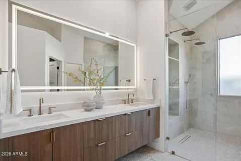 a bathroom with a double vanity sink mirror and double