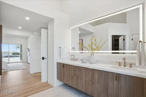 a bathroom with a double vanity sink and a mirror