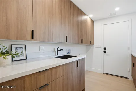 a kitchen with a sink and cabinets