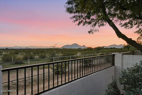 a view of a house with swimming pool and sitting area
