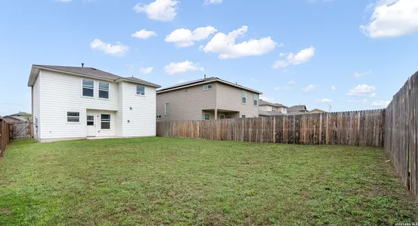 a view of a backyard of the house
