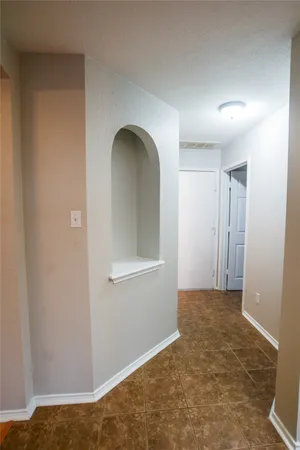 a view of a livingroom with wooden floor and a fireplace