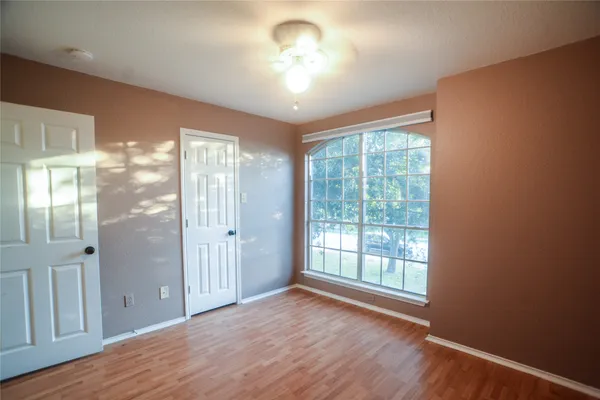 a kitchen with a sink a stove a refrigerator and a window