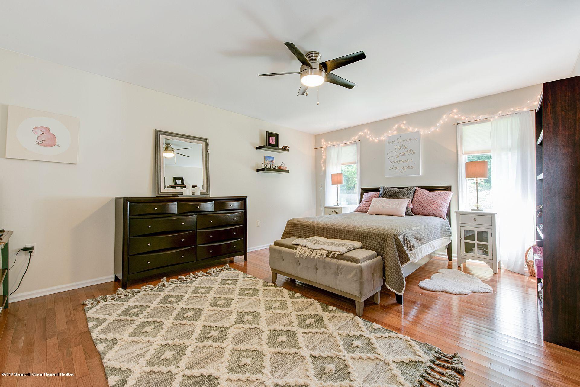 75 Seven Bridges Road Little Silver, NJ 07739 - Photo 29 of 43 a bedroom with a bed and wooden floor