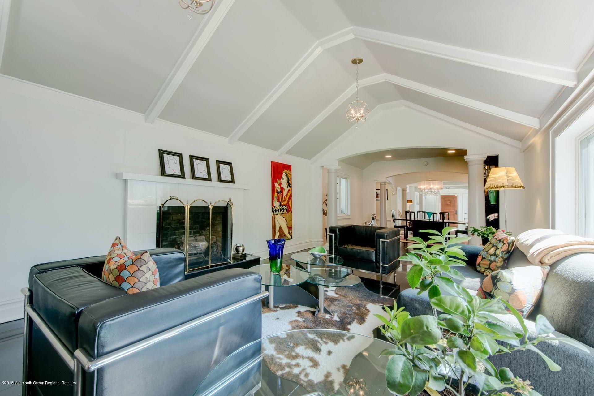 75 Seven Bridges Road Little Silver, NJ 07739 - Photo 7 of 43 a living room with furniture fireplace and a potted plant